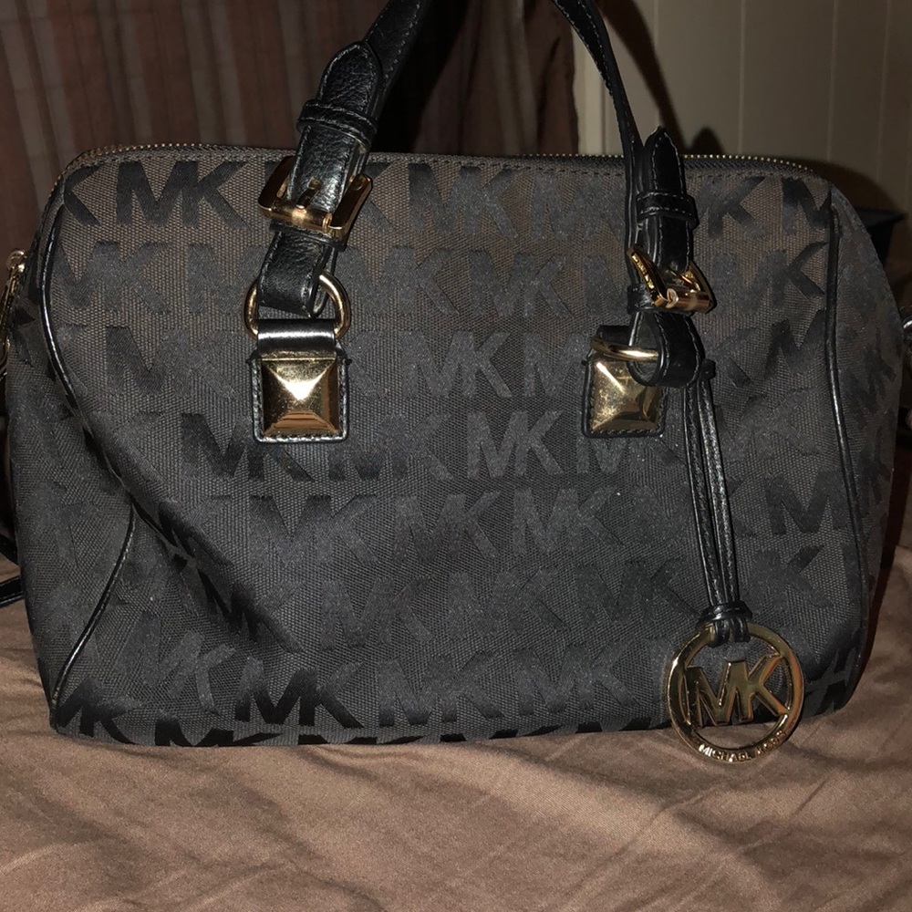 Michael Kors black and gold purse.